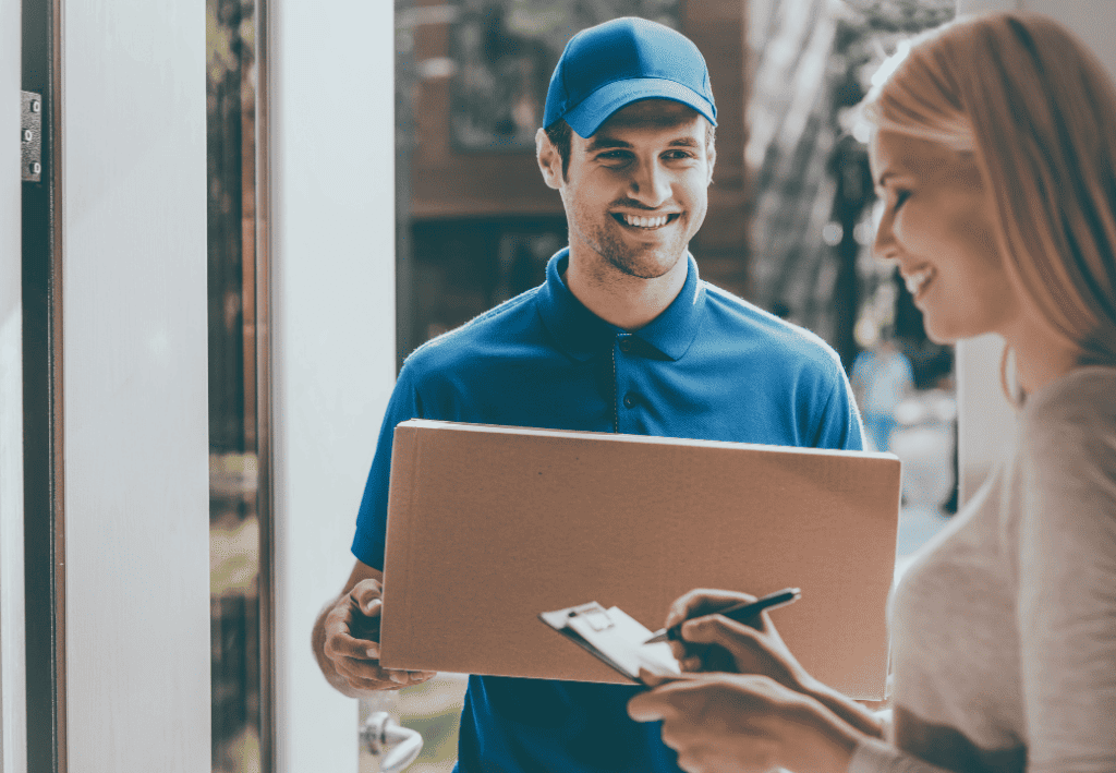 delivery man giving a package to a customer