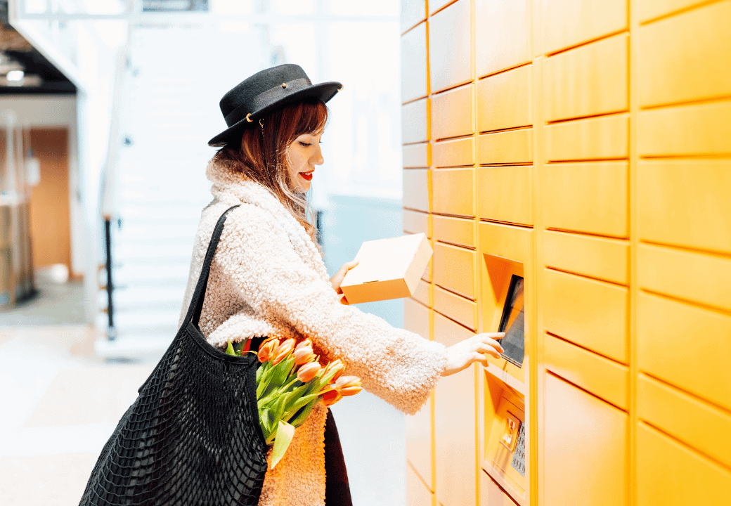 woman taking her parcel at a locker