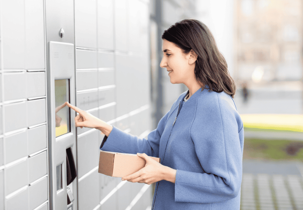 woman taking her parcel at a parcel locker
